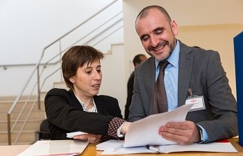 two people look at paperwork